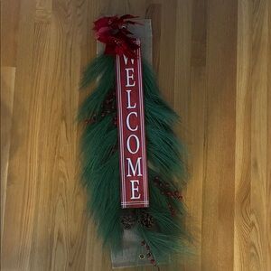 Festive Welcome Sign with Greenery and Red Accents